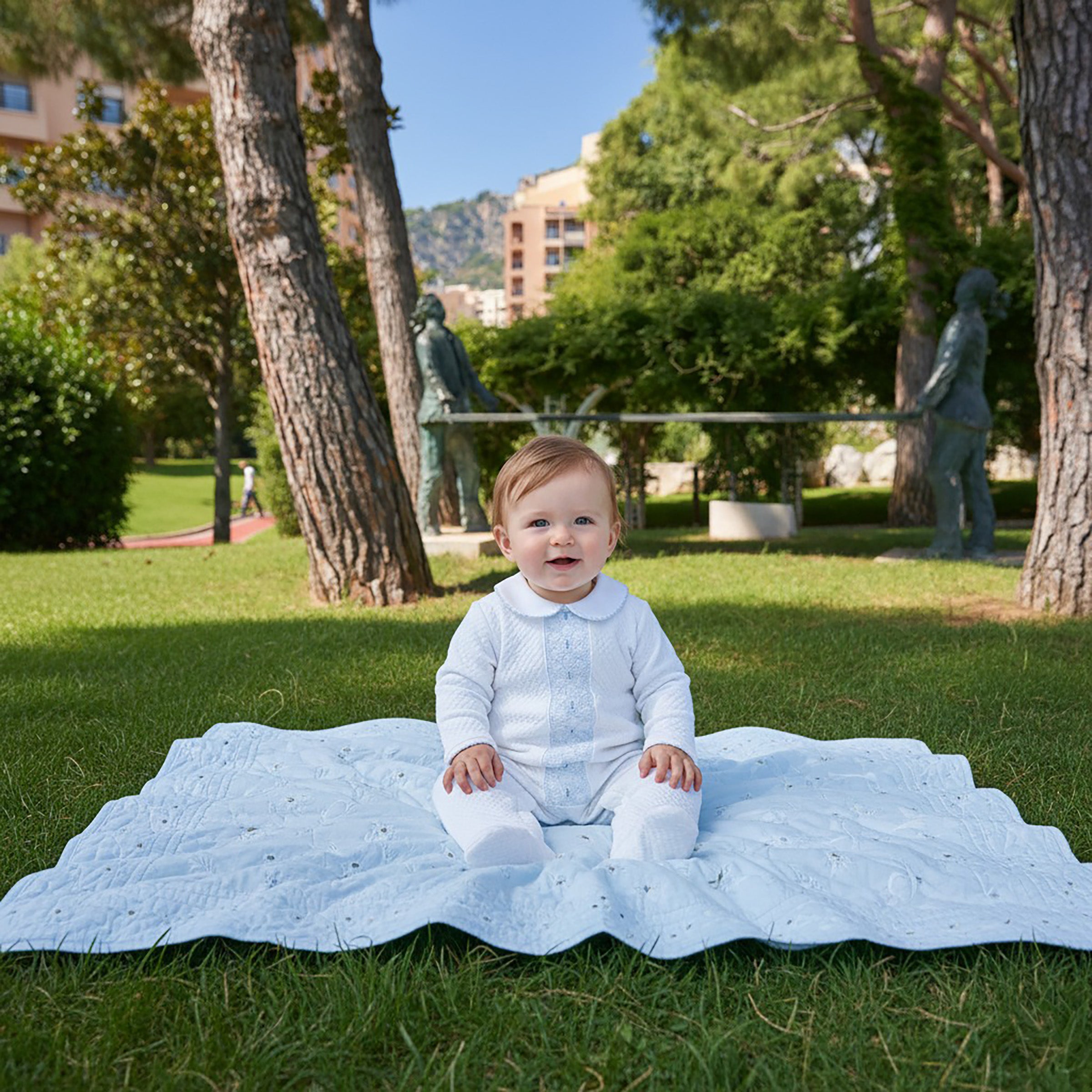 Bbay boy is wearing quilted Beau babygrow