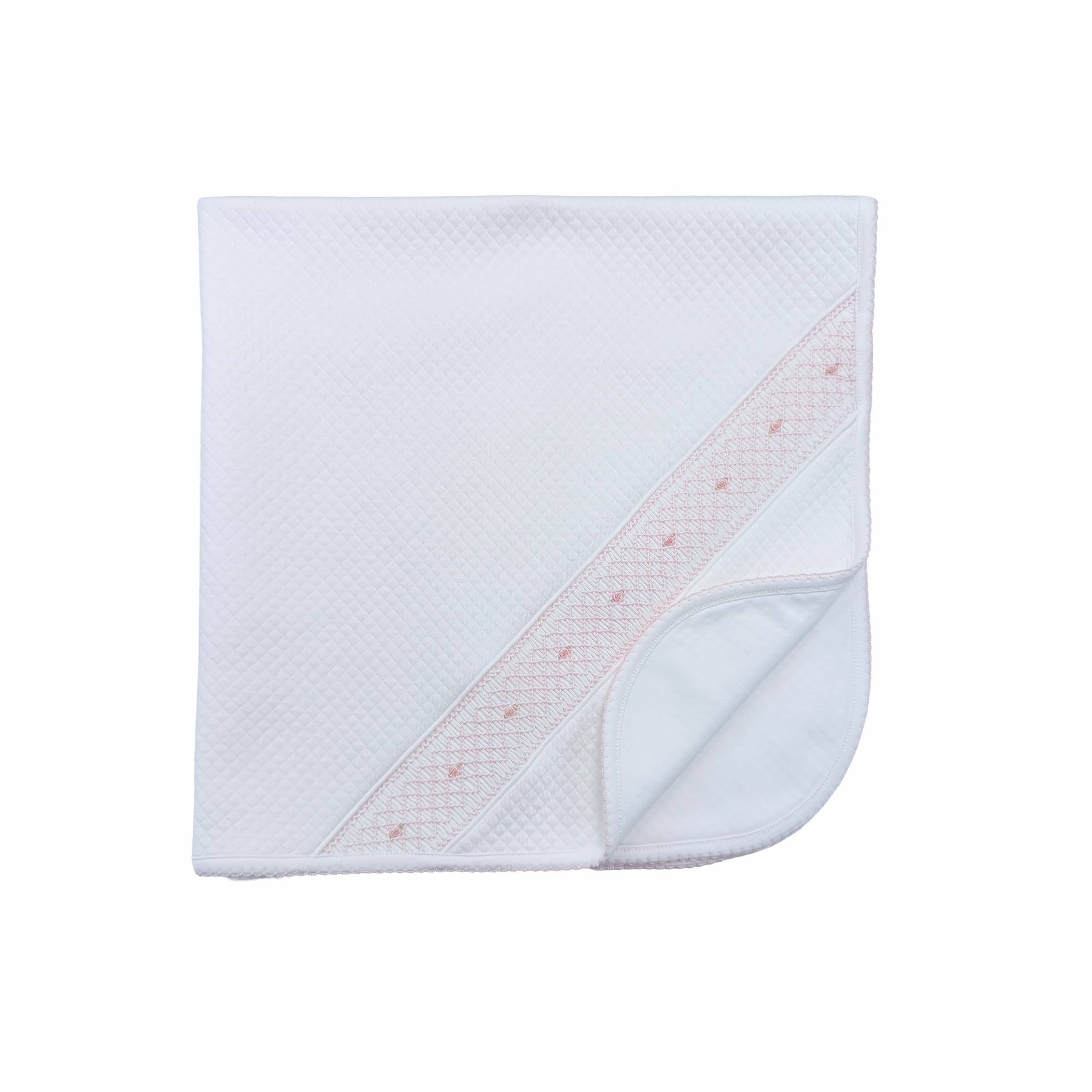 Folded quilted baby blanket showing plush texture and elegant craftsmanship.