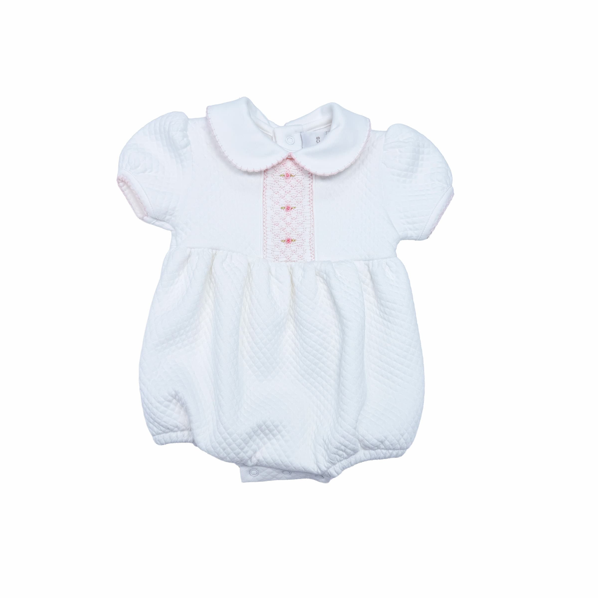 Hand-smocked white bubble romper with quilted texture — front view