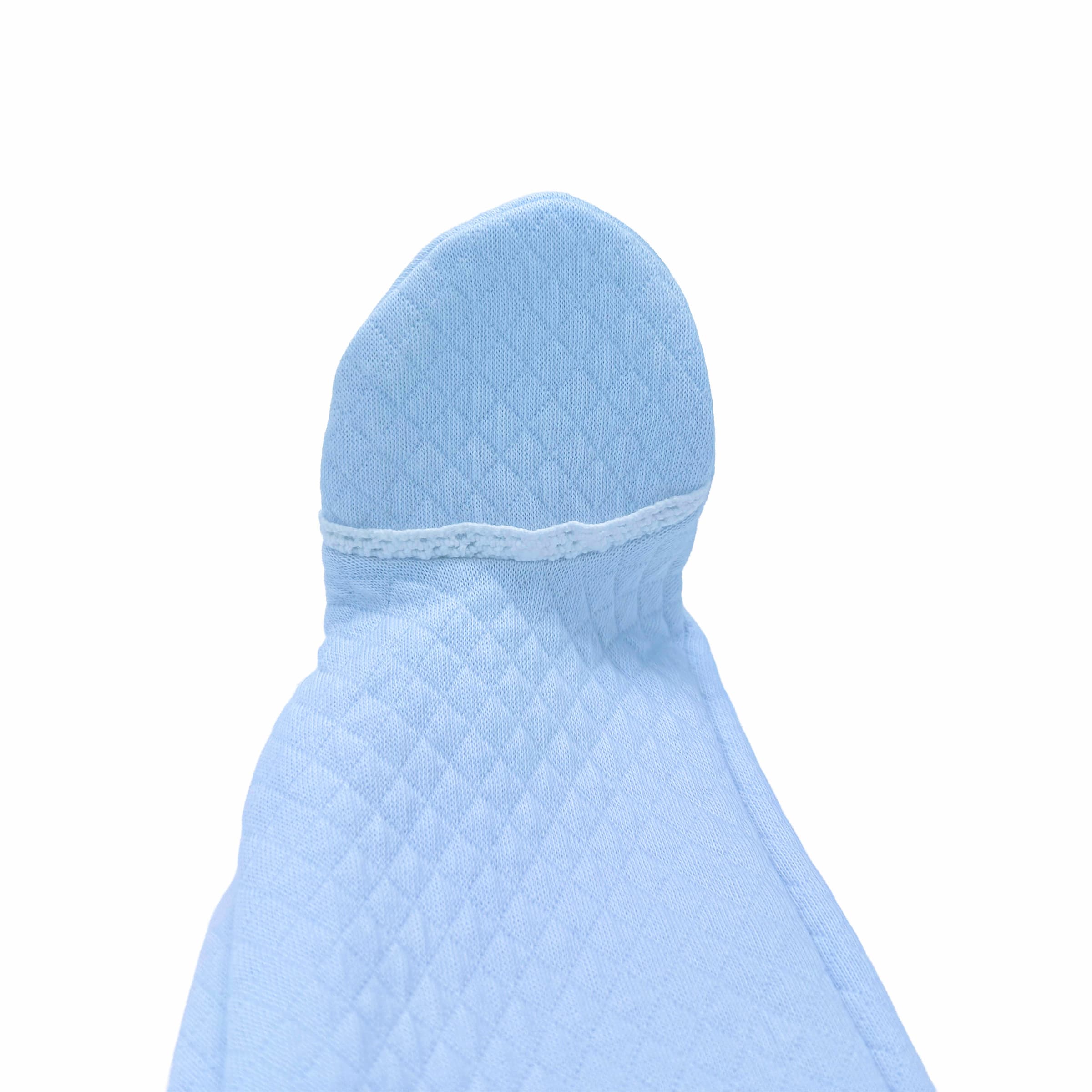 Close-up of decorative trimon a foot of the baby boy babygrow