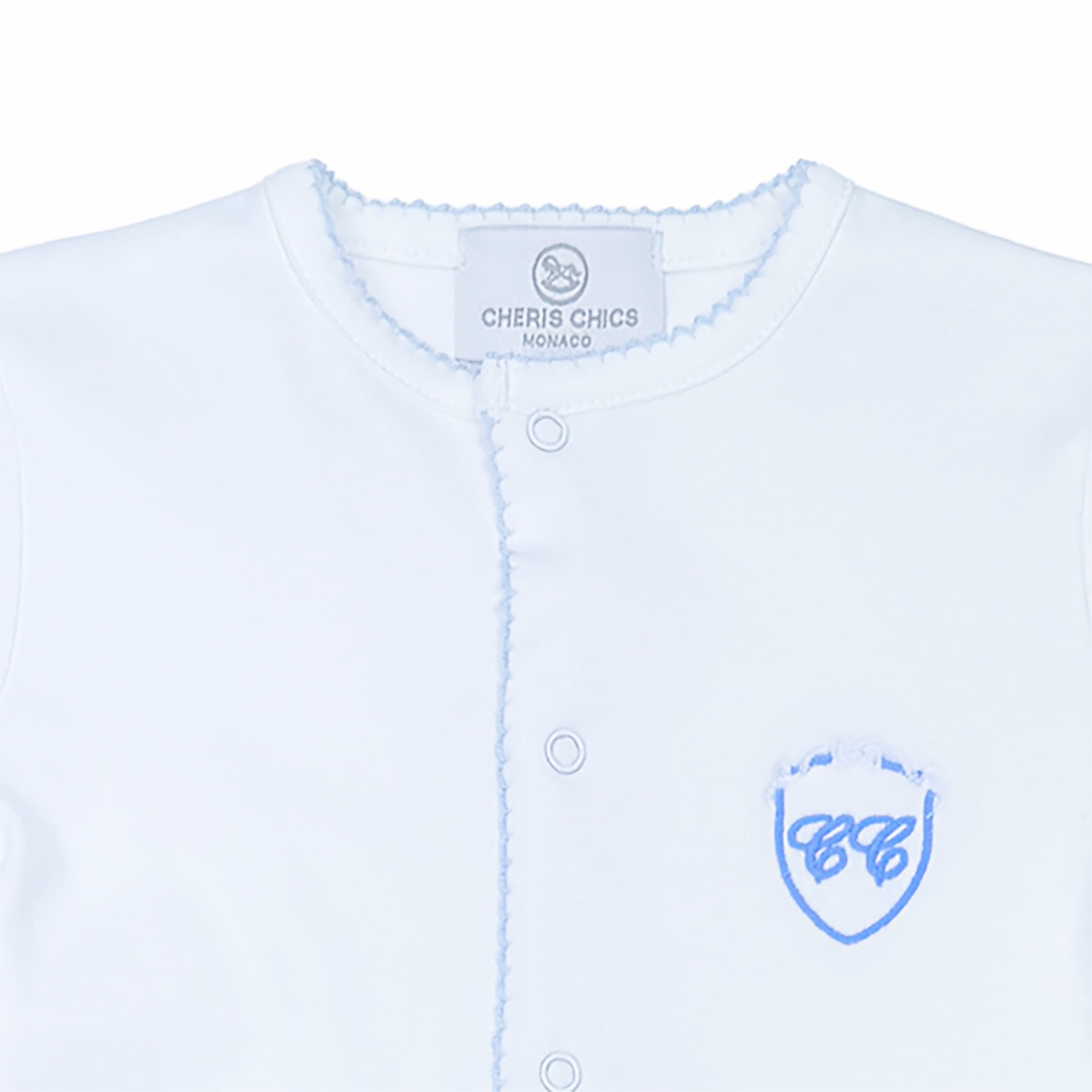 Close-up of embroidered motif and smooth interlock fabric