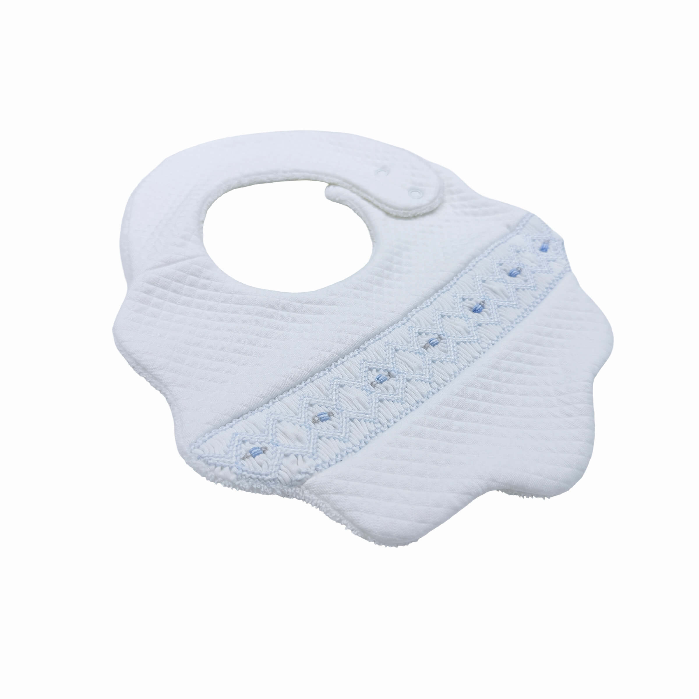Luxury baby boy bib with quilted cotton and hand-smocked detailing – front side view