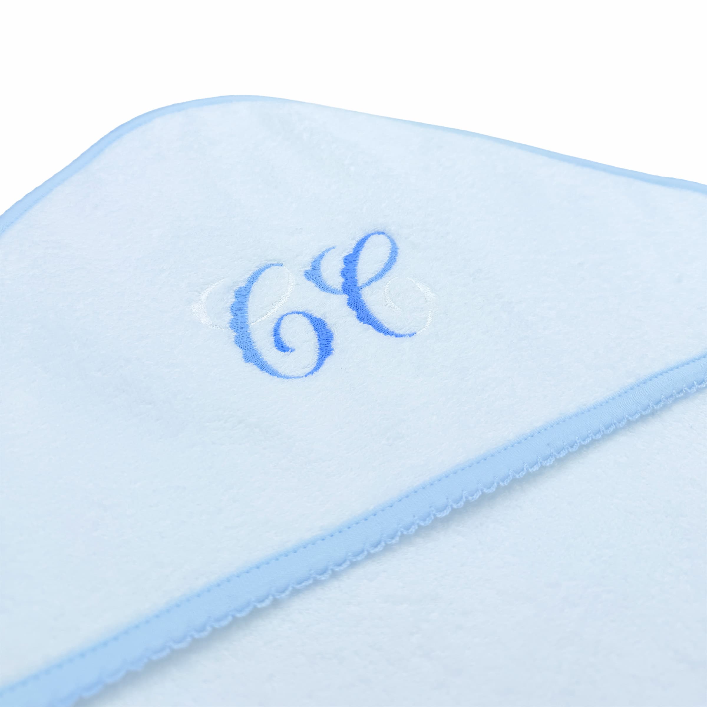 Embroidery deatil on aWhite hooded baby towel with picot trim 