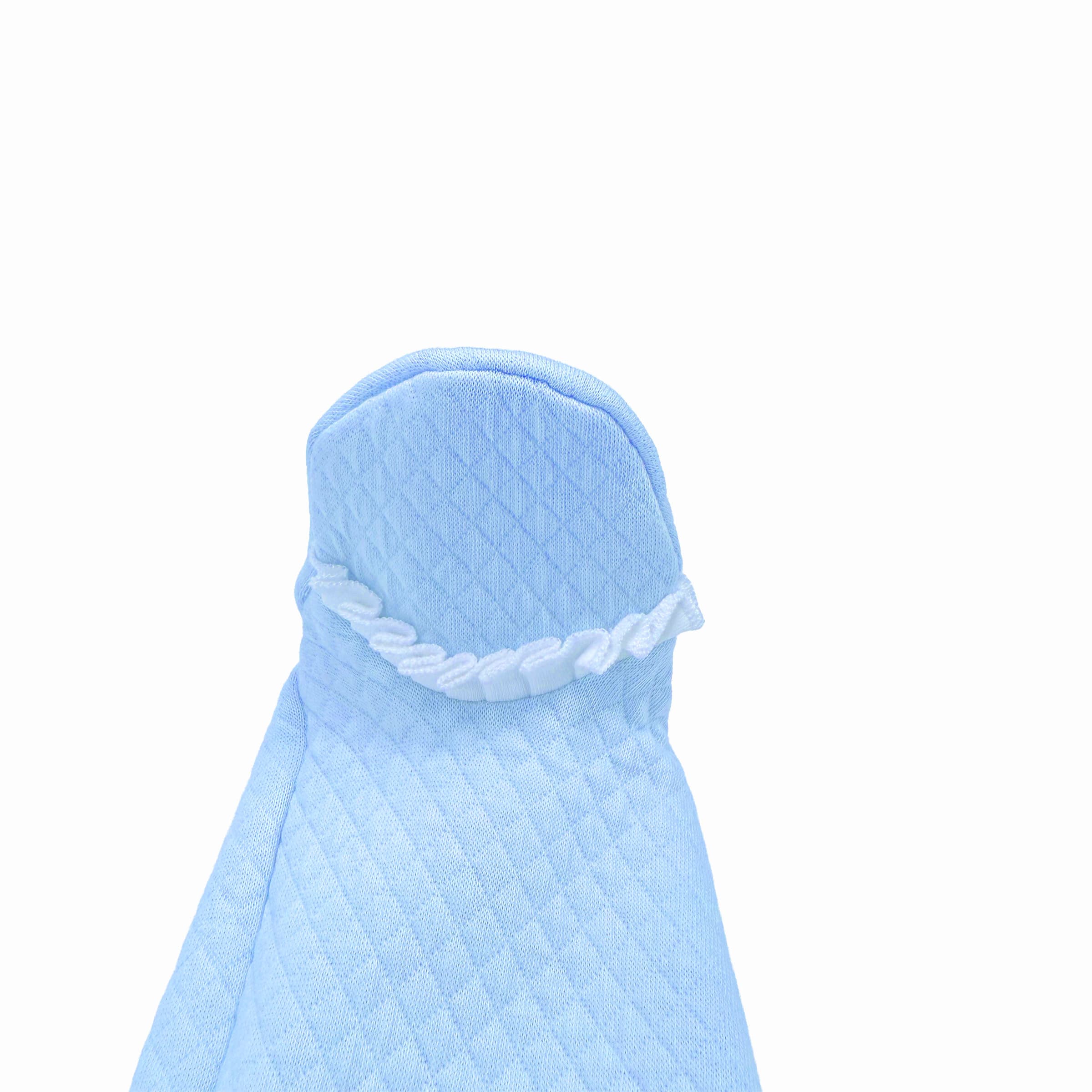 Close-up of volant frill trimming on baby boy babygrow
