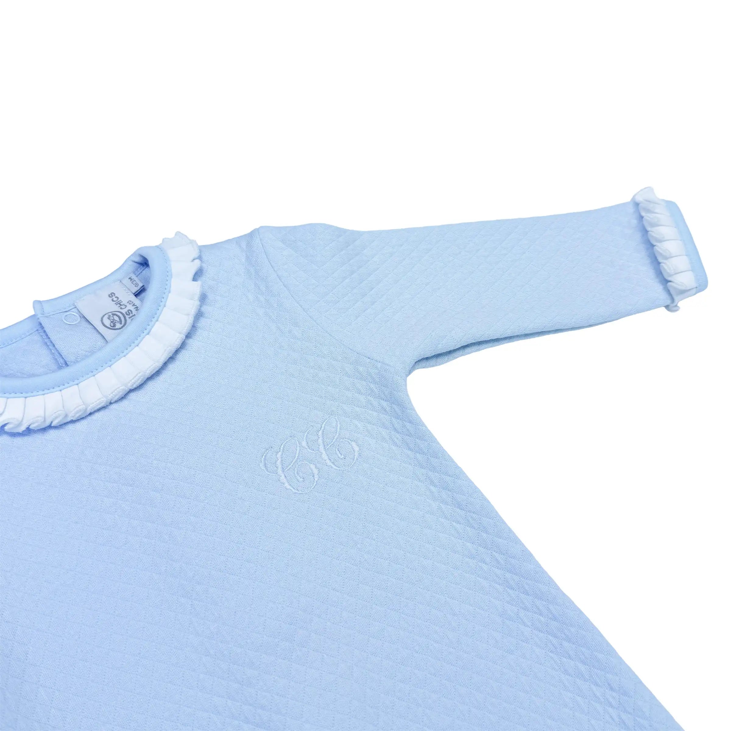 Light blue babygrow with ruffled collar on a white background