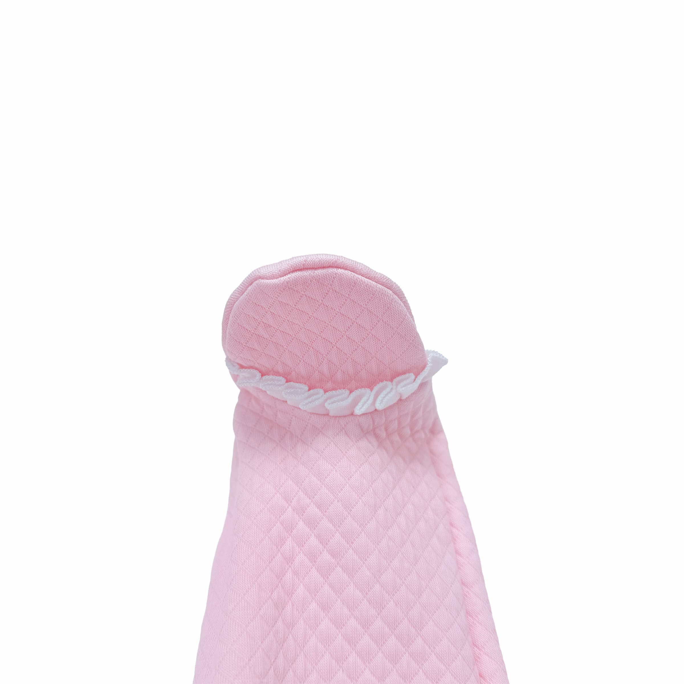 Close-up of volant frills on baby girl babygrow